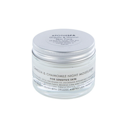 A transparent jar with a silver lid, labeled 'Camellia & Chamomile Night Moisturiser for sensitive skin' by ApoTherpa. The product is marketed as organic and natural.